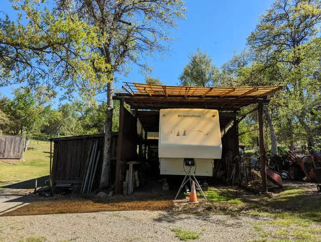 a view of a couches in the patio and a yard