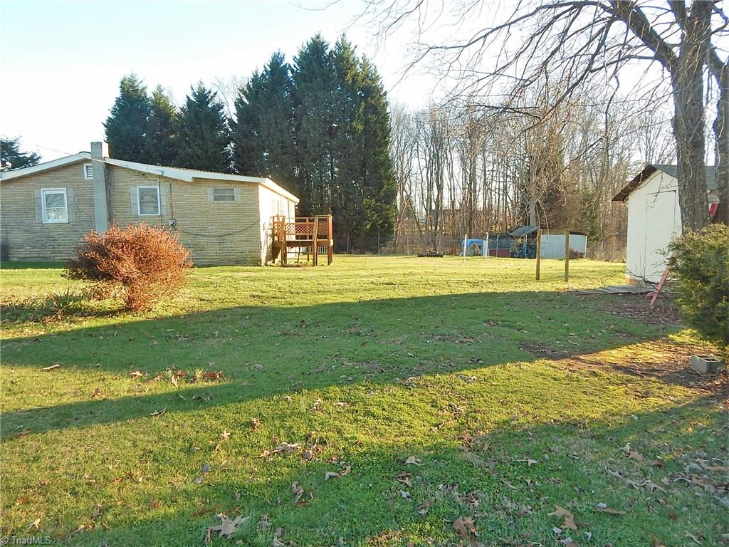 8607 Hudson James Road Summerfield, NC 27358 - Photo 27 of 30 Back yard/adjoining lot
