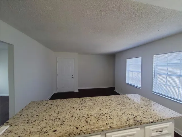 a view of a livingroom with wooden floor