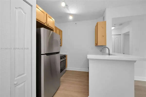 a bathroom with a double vanity sink mirror and shower