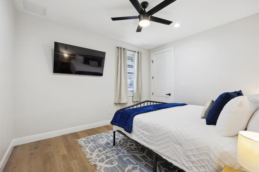 413 Hoot Avenue Graford, TX 76449 - Photo 16 of 38 a bedroom with a bed and a flat screen tv