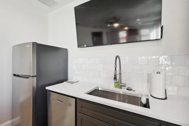 a bathroom with a sink and mirror