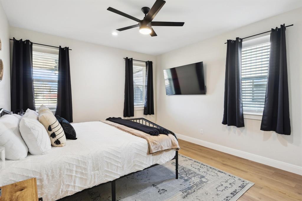 413 Hoot Avenue Graford, TX 76449 - Photo 31 of 38 a bedroom with a bed and a flat screen tv