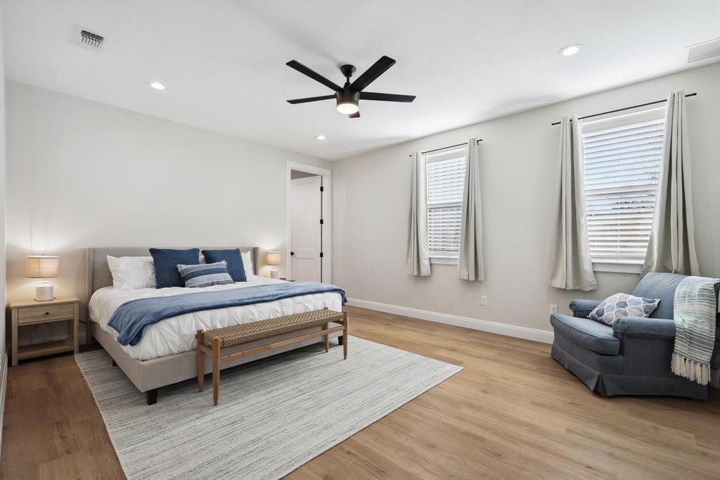 413 Hoot Avenue Graford, TX 76449 - Photo 10 of 38 a spacious bedroom with a bed and a couch