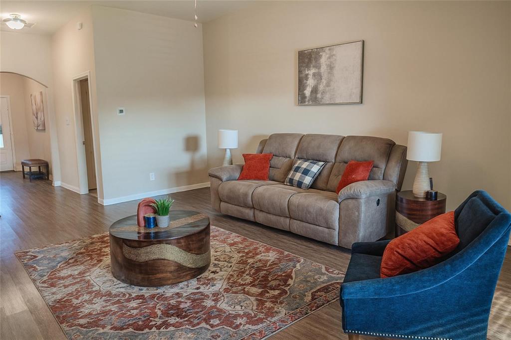 1837 Rialto Lane Crowley, TX 76036 - Photo 5 of 24 Open-concept living area featuring wood-finish flooring, neutral wall tones, and recessed lighting
