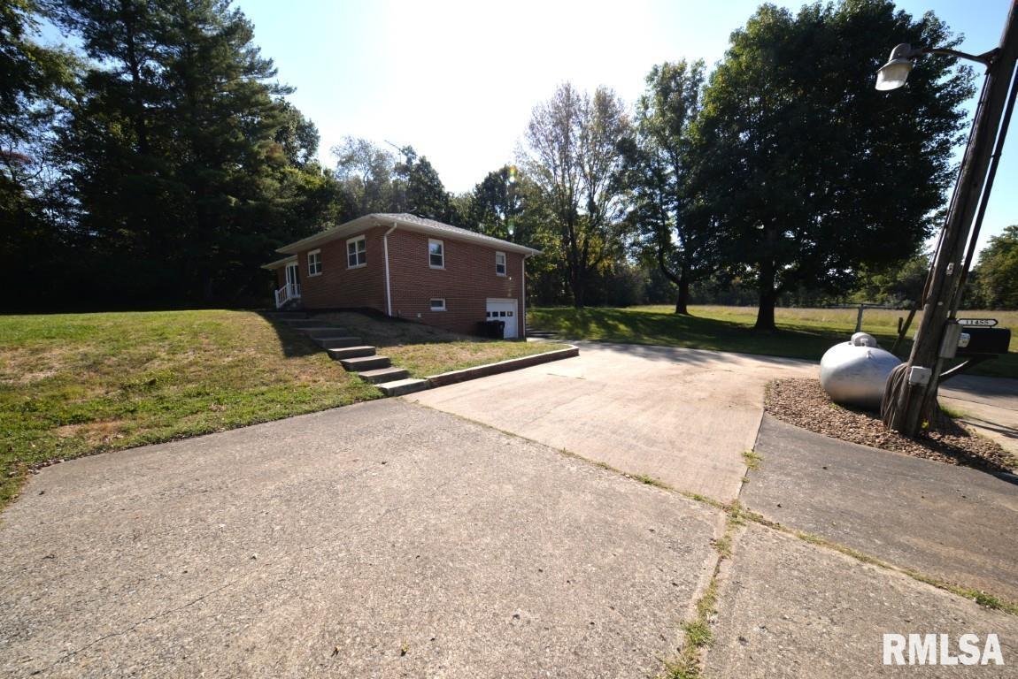 11455 East Richview Road Mount Vernon, IL 62864 - Photo 10 of 37 a view of a street with a bench and trees