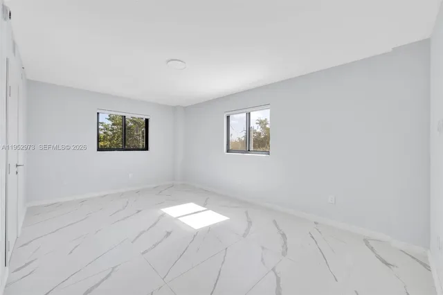 an empty room with windows