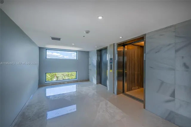 a living room with furniture and a gate