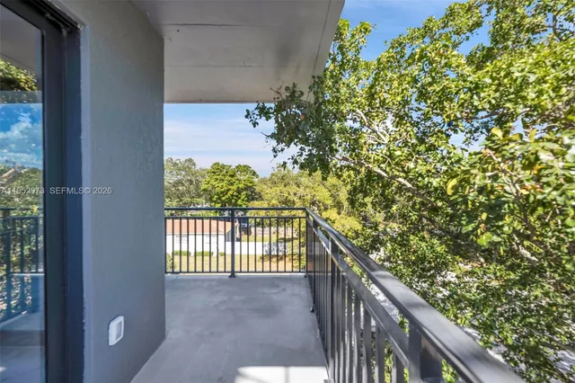 a view of balcony and yard