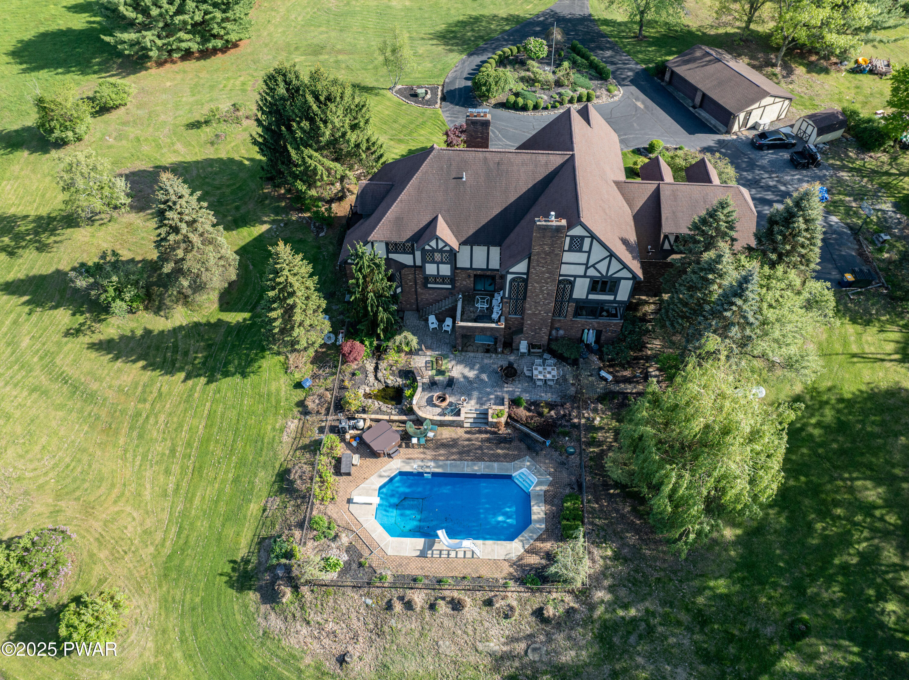 555 Valley View Road Dallas, PA 18612 - Photo 70 of 99 an aerial view of a house with swimming pool and garden