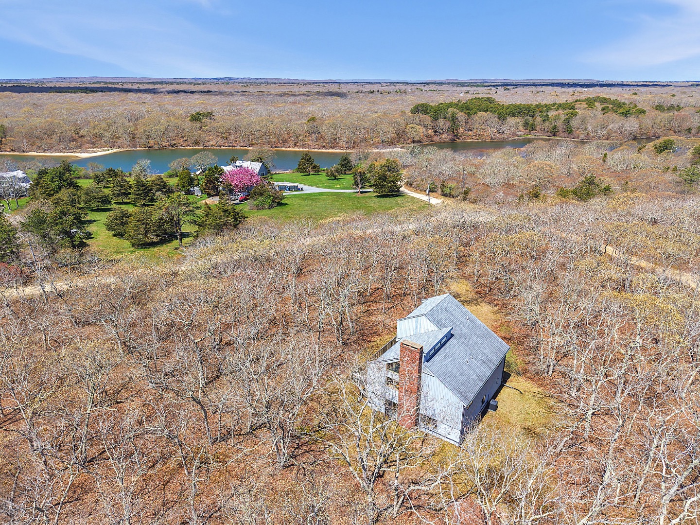 82 Oyster Pond Road Edgartown, MA 02539 - Photo 2 of 53 an aerial view of a house with a yard and ocean view
