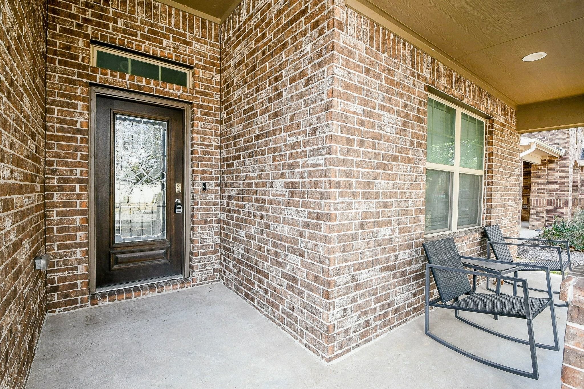 1515 Anyder Place Houston, TX 77047 - Photo 3 of 21 a brick building with a bench and a window