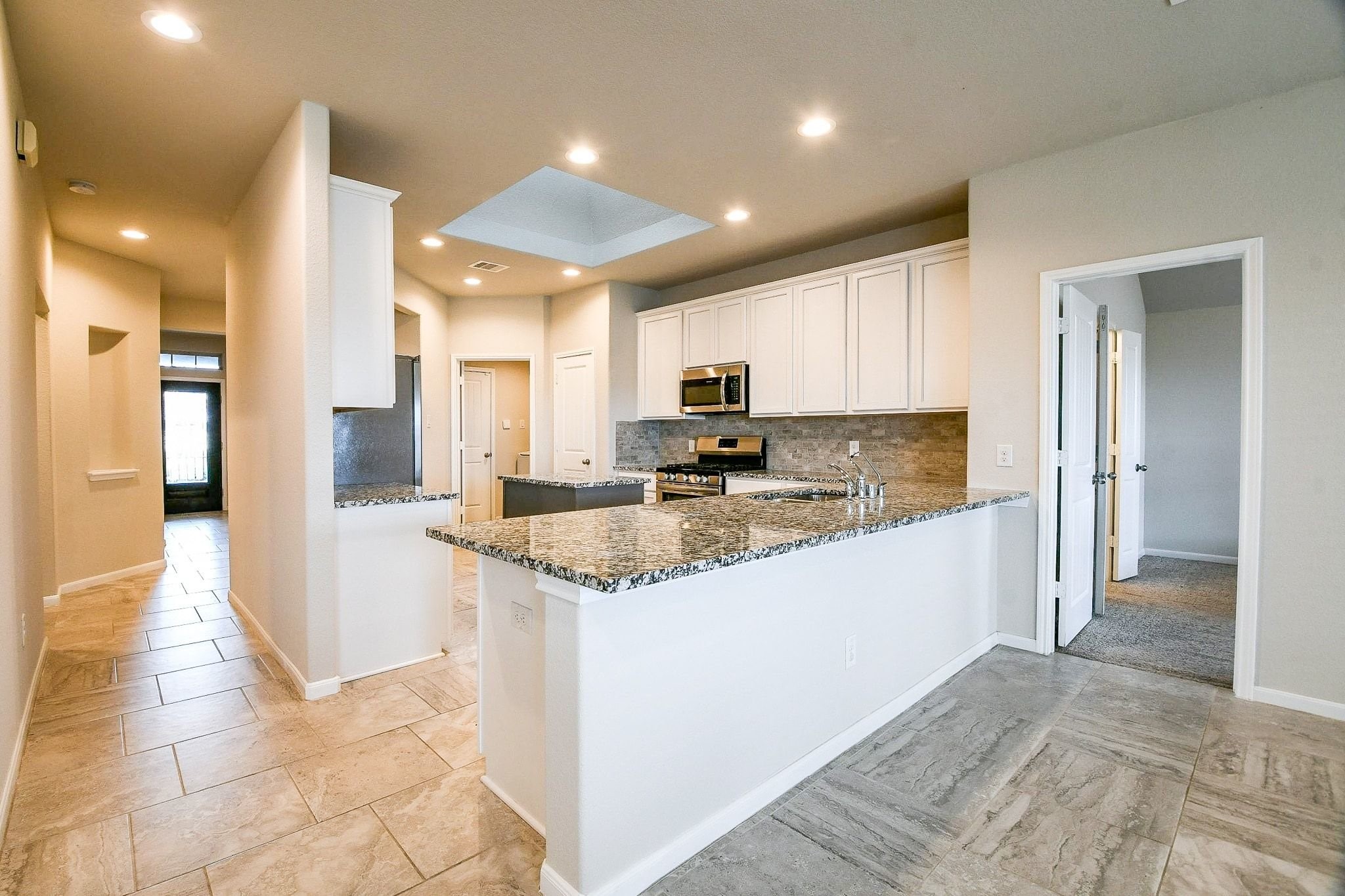 1515 Anyder Place Houston, TX 77047 - Photo 8 of 21 a kitchen with stainless steel appliances granite countertop a refrigerator and a sink