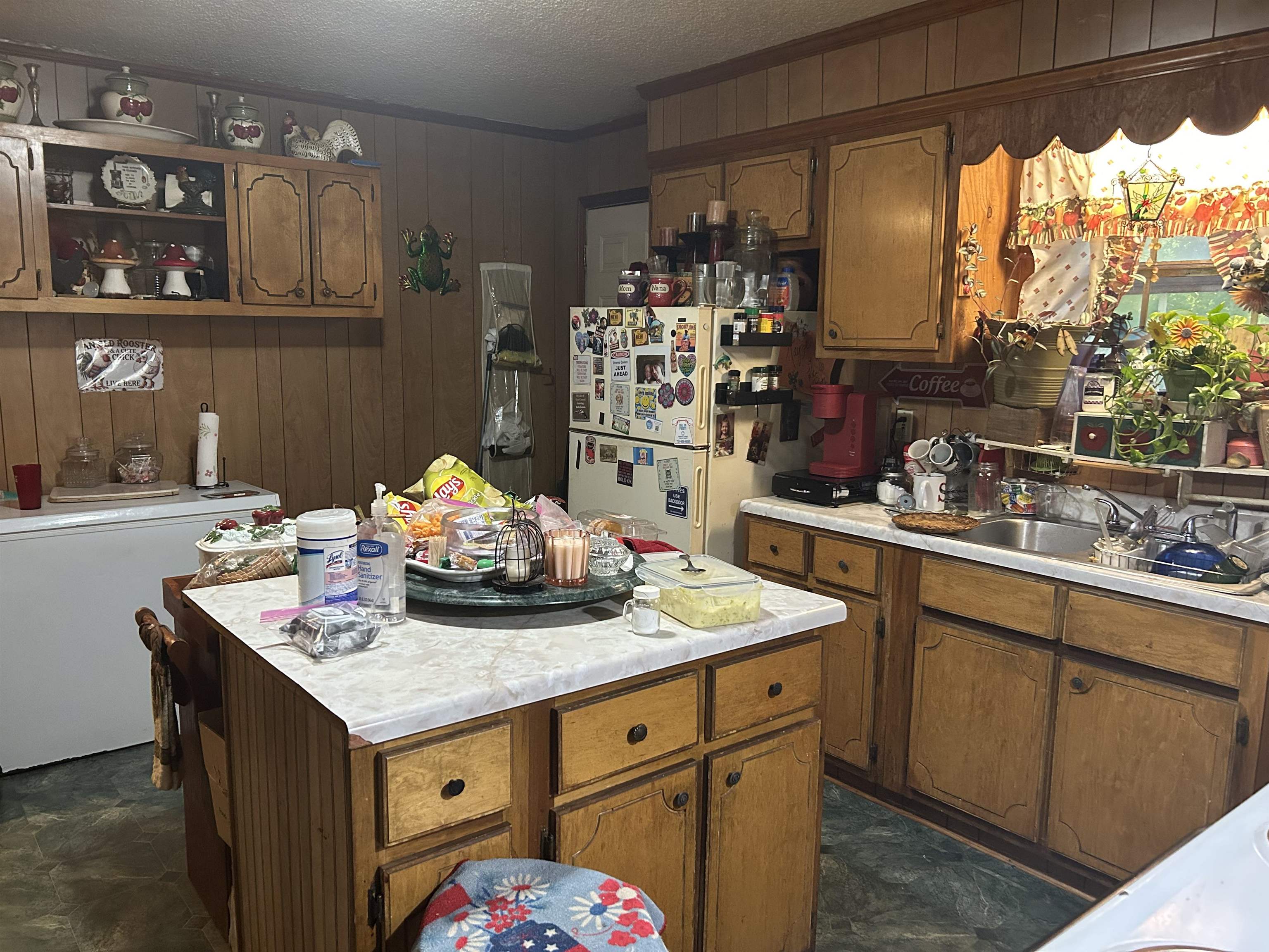 3125 Plainview Road Henderson, TN 38340 - Photo 2 of 9 a kitchen with a sink a stove and a wooden floor