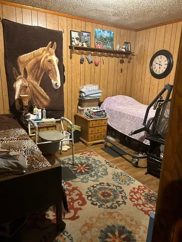 a bathroom with a toilet and a shower curtain