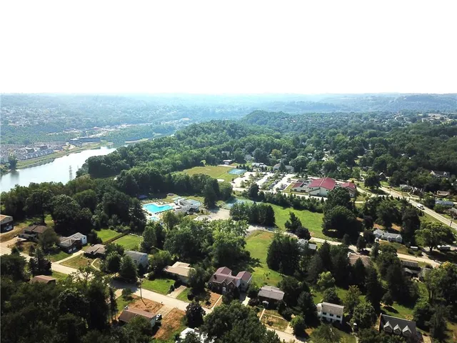 an aerial view of house with yard