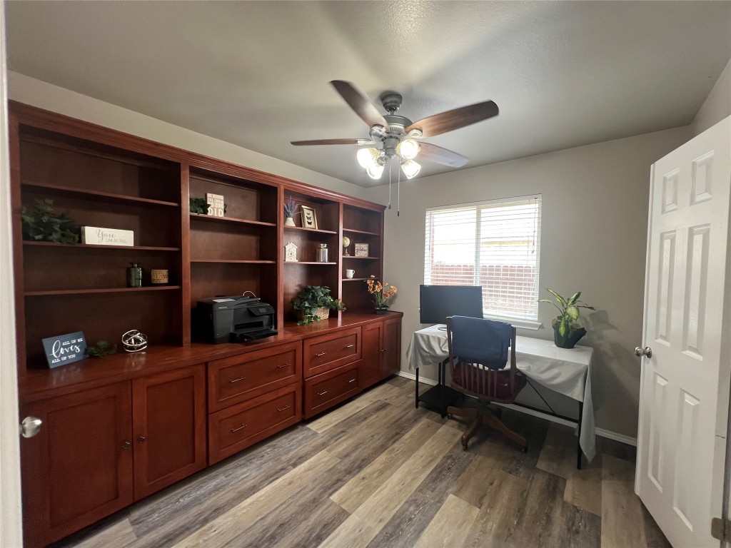404 Patton Cove Bastrop, TX 78602 - Photo 29 of 40 Home office featuring ceiling fan, and light wood-style flooring