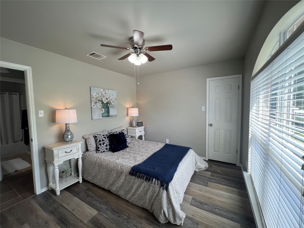 404 Patton Cove Bastrop, TX 78602 - Photo 32 of 40 Bedroom featuring dark wood-type flooring, a ceiling fan,