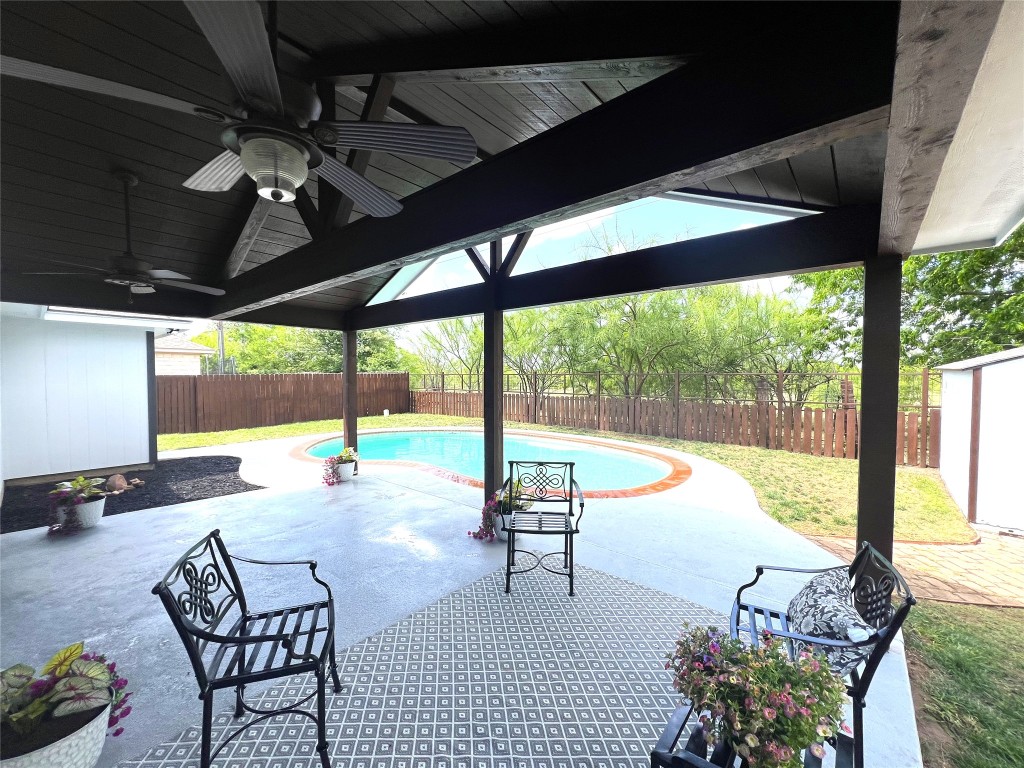 404 Patton Cove Bastrop, TX 78602 - Photo 8 of 40 View of patio / terrace with a fenced backyard, a fenced in pool, and ceiling fan