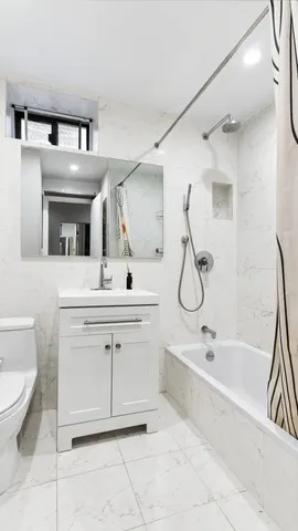 a kitchen with kitchen island granite countertop a table and chairs in it