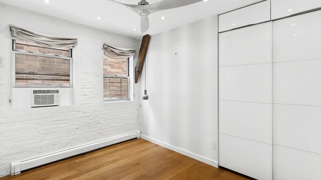 a spacious bathroom with a double vanity sink a mirror and a bathtub