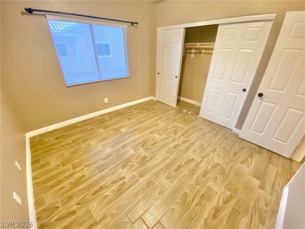 2000 Turquoise Ridge Street, Unit 204 Las Vegas, NV 89117 - Photo 19 of 29 A well-lit bedroom offering ample storage and durable tile flooring for easy maintenance.