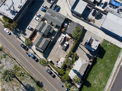 an aerial view of a residential apartment building with a yard