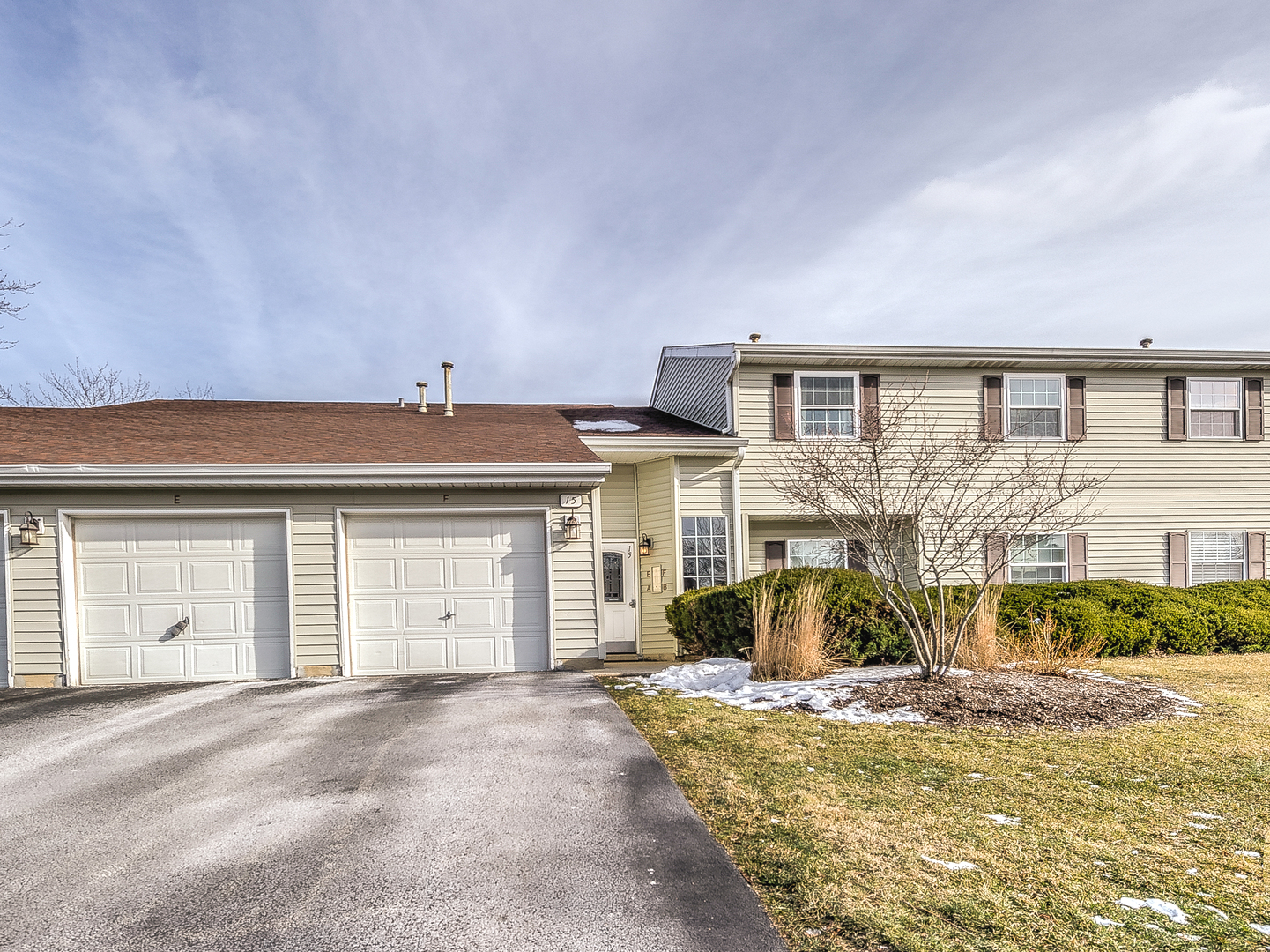 15 Gant Circle, Unit E Streamwood, IL 60107 - Photo 1 of 18 a view of a white house with a large space in front of it
