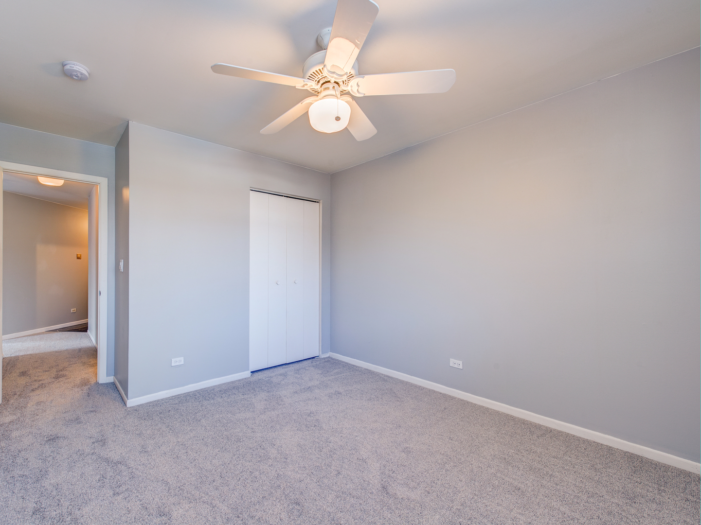 15 Gant Circle, Unit E Streamwood, IL 60107 - Photo 13 of 18 an empty room with windows and fan