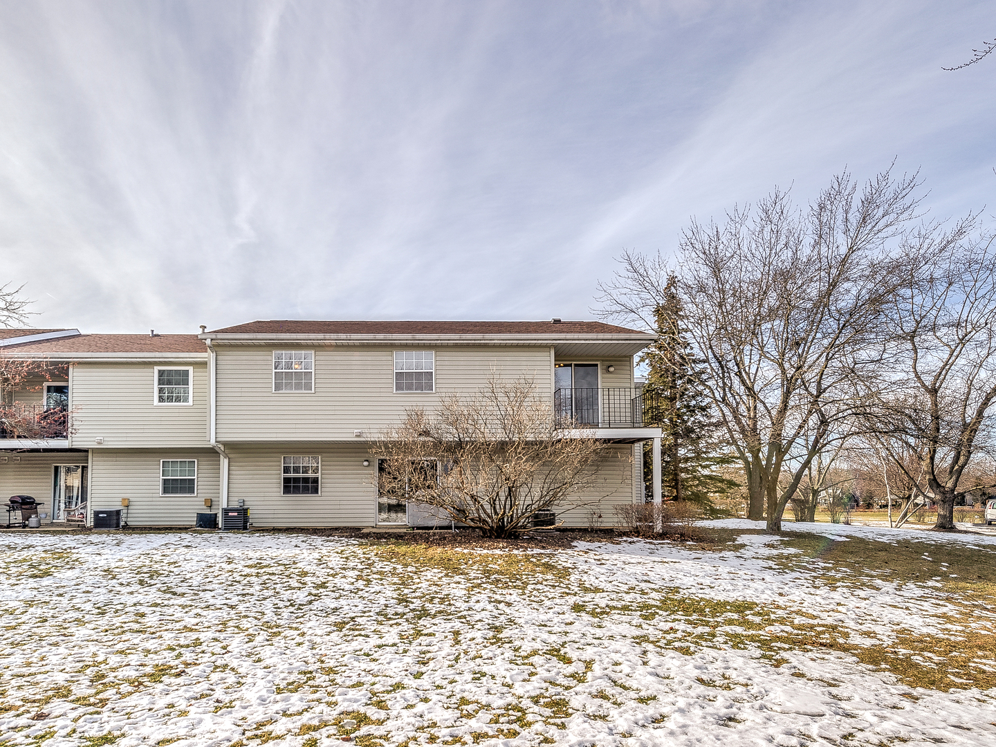 15 Gant Circle, Unit E Streamwood, IL 60107 - Photo 16 of 18 a front view of a house with a yard