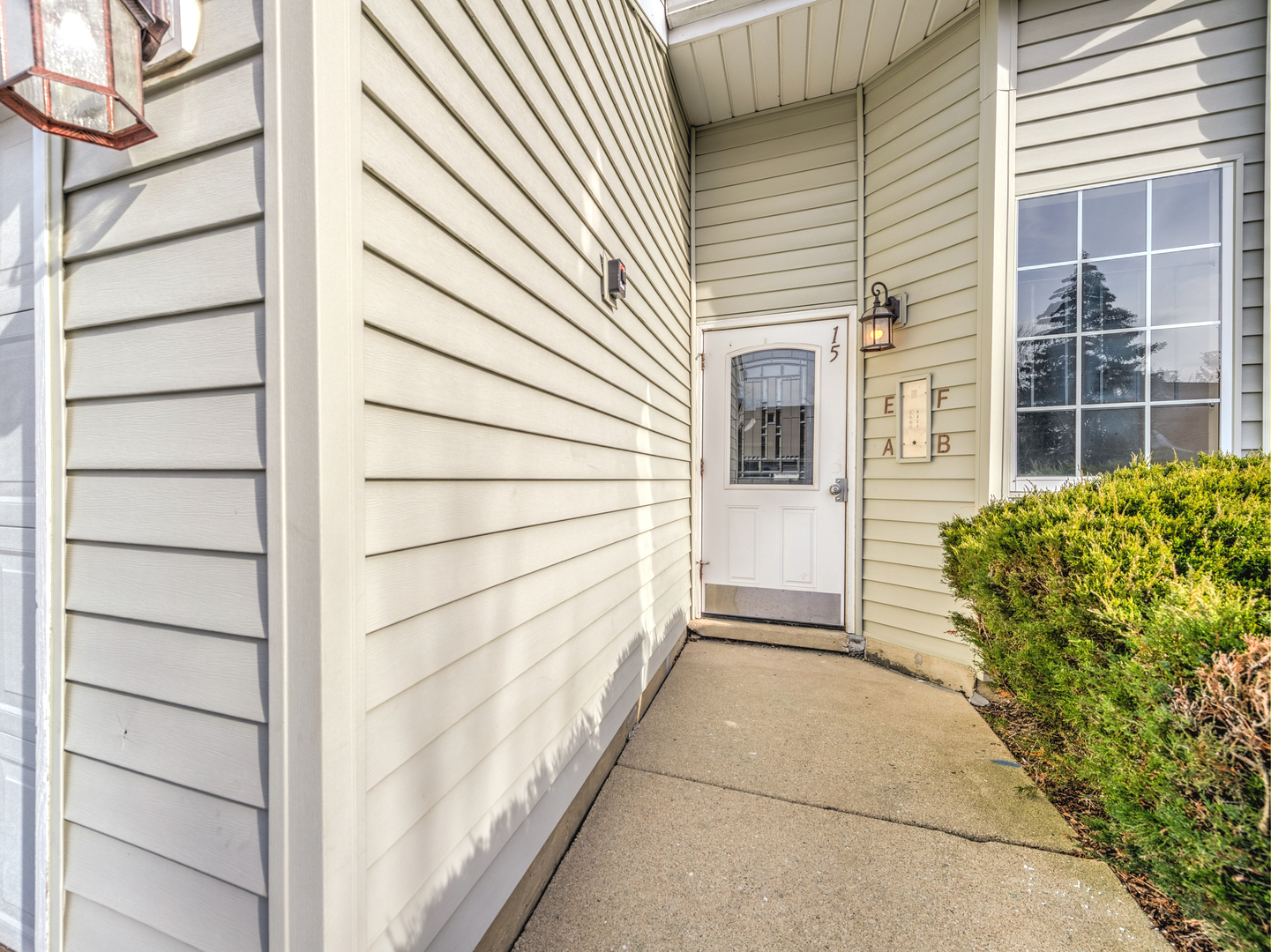15 Gant Circle, Unit E Streamwood, IL 60107 - Photo 2 of 18 a view of a house with a door and wooden walls