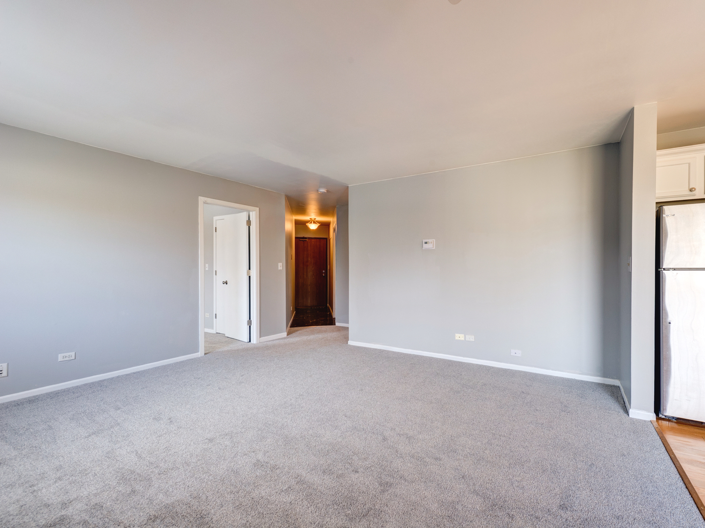 15 Gant Circle, Unit E Streamwood, IL 60107 - Photo 3 of 18 a view of an empty room with a window
