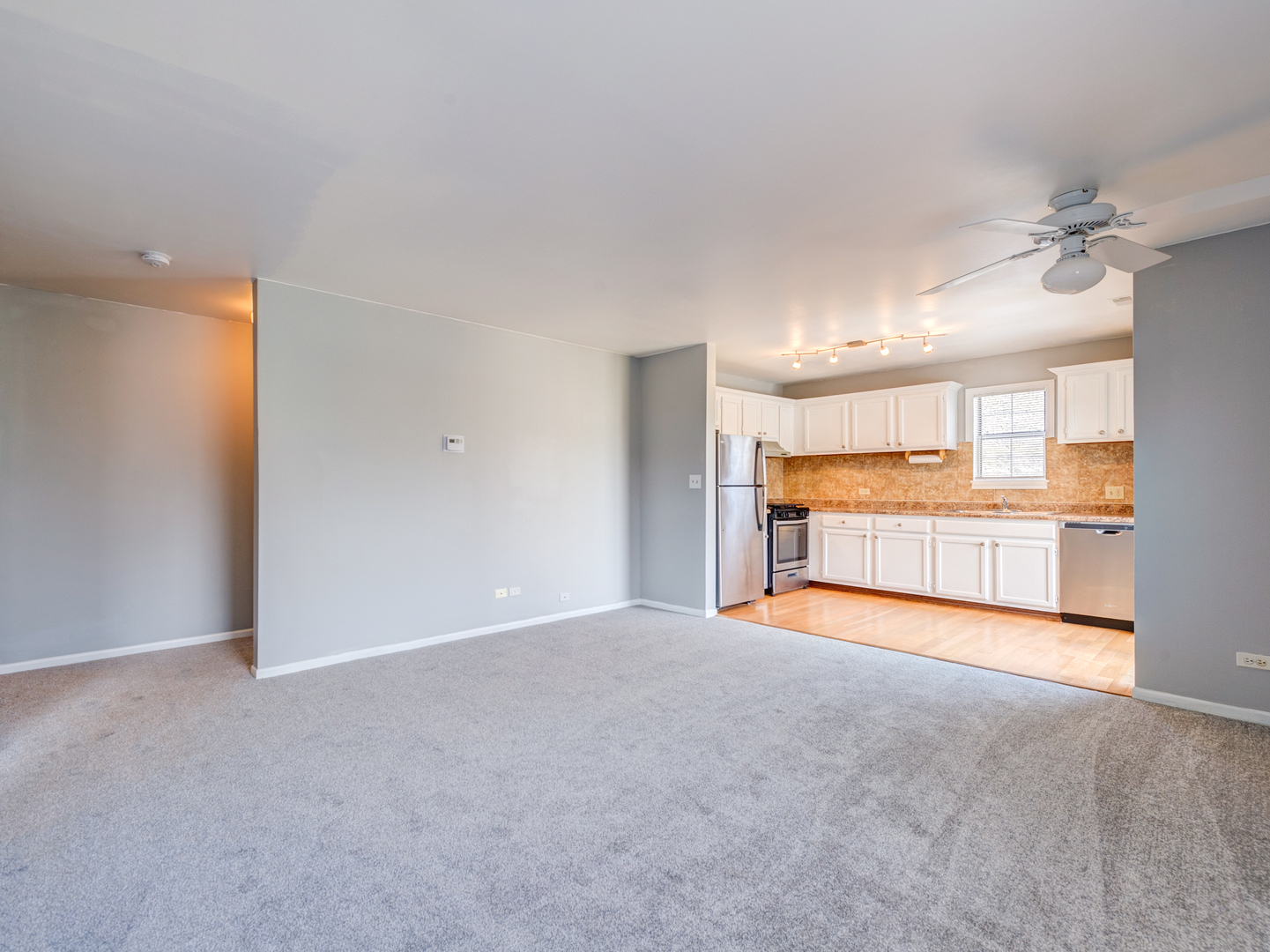 15 Gant Circle, Unit E Streamwood, IL 60107 - Photo 5 of 18 a view of an empty room with a window