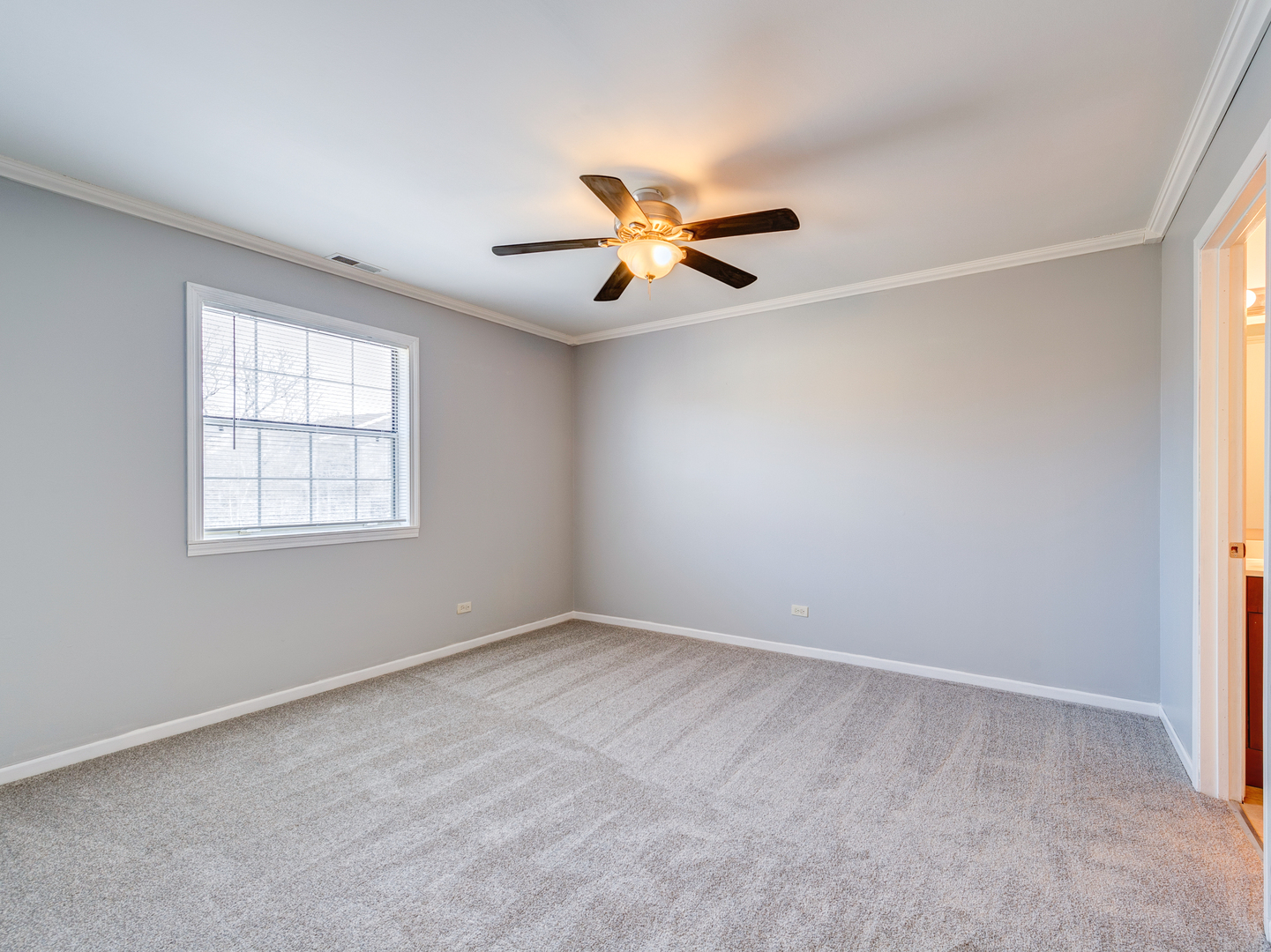 15 Gant Circle, Unit E Streamwood, IL 60107 - Photo 8 of 18 wooden floor in an empty room with a window