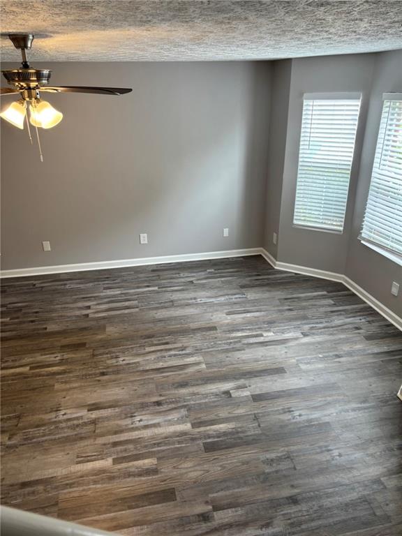 5739 Windfall Lane Lithonia, GA 30058 - Photo 5 of 36 a view of an empty room with window and wooden floor