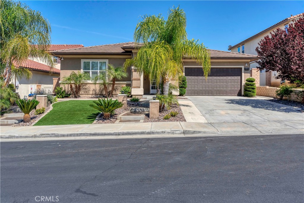 30668 Stage Coach Road Menifee, CA 92584 - Photo 1 of 1 a front view of a house with a yard and a garage