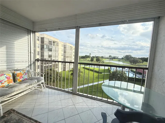 a balcony with furniture and water view