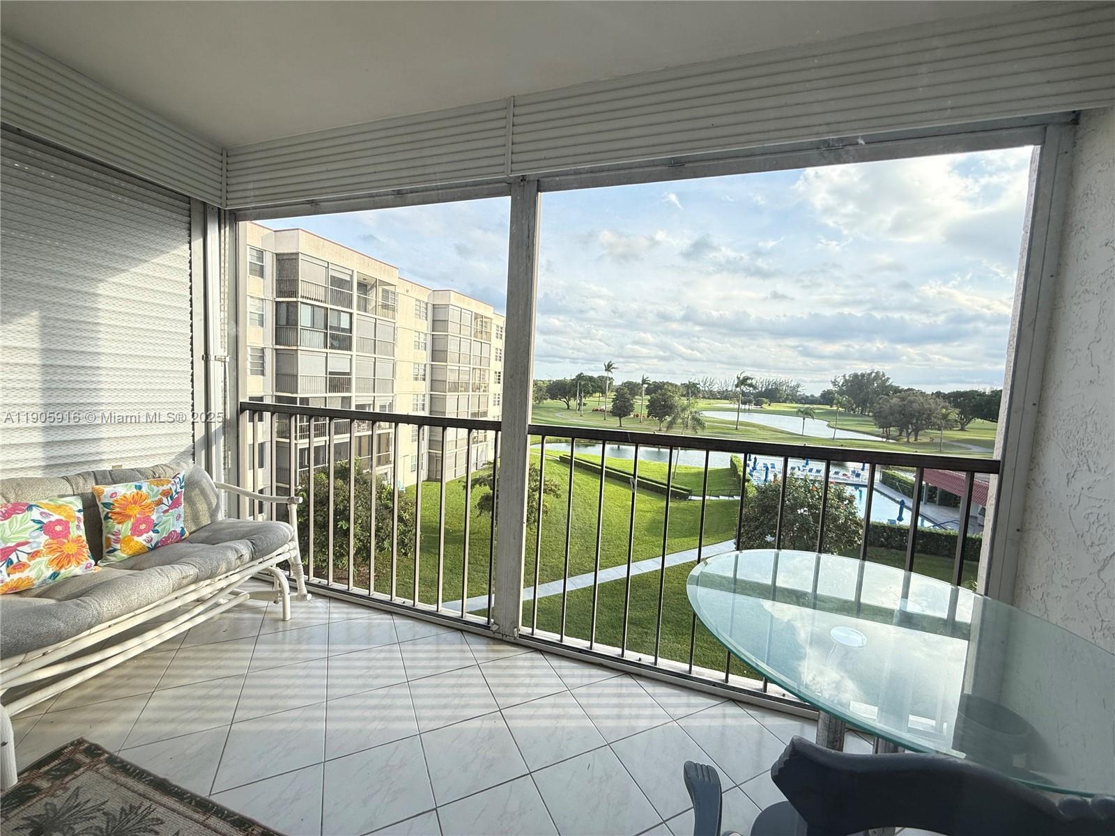a balcony with furniture and water view