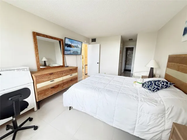 a bedroom with a bed and furniture