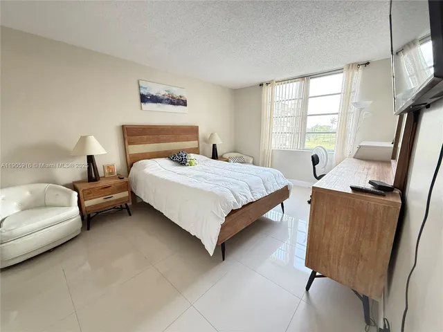 a bedroom with a bed and furniture