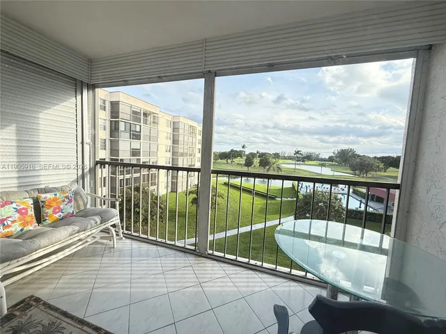 a balcony with furniture and water view