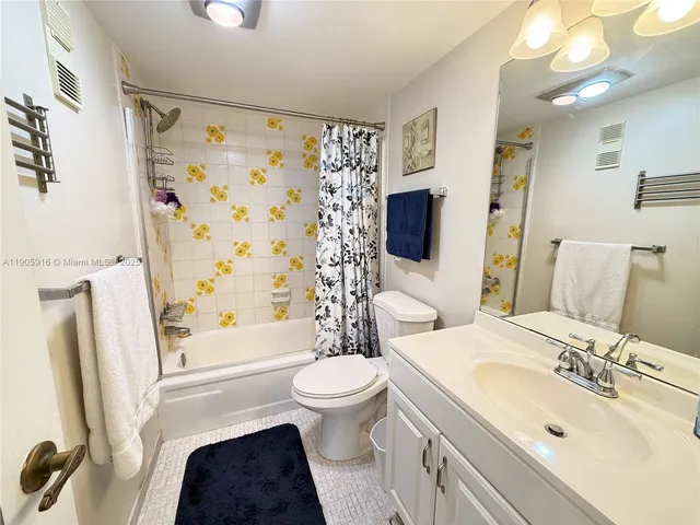 a bedroom with a bed and a view of bathroom