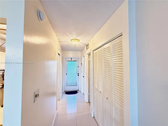 a bathroom with a shower and a sink