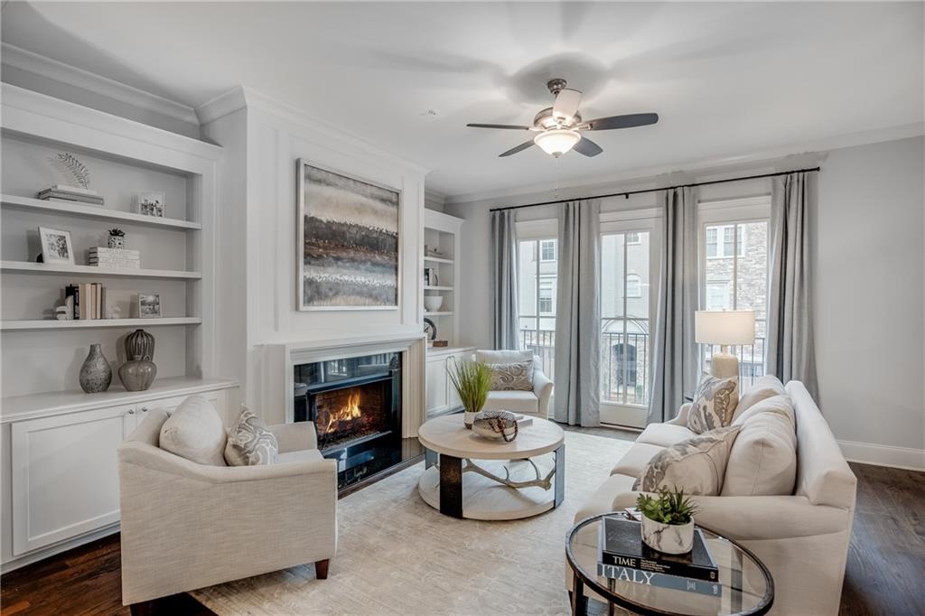 3440 Commander Cove Suwanee, GA 30024 - Photo 11 of 59 a living room with furniture and a fireplace