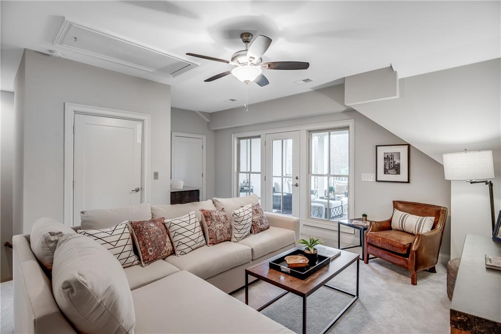 3440 Commander Cove Suwanee, GA 30024 - Photo 38 of 59 a living room with furniture and a large window