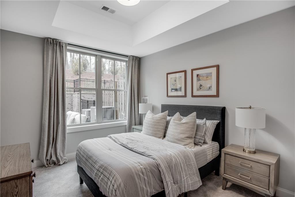 3440 Commander Cove Suwanee, GA 30024 - Photo 45 of 59 a bedroom with a bed and a window