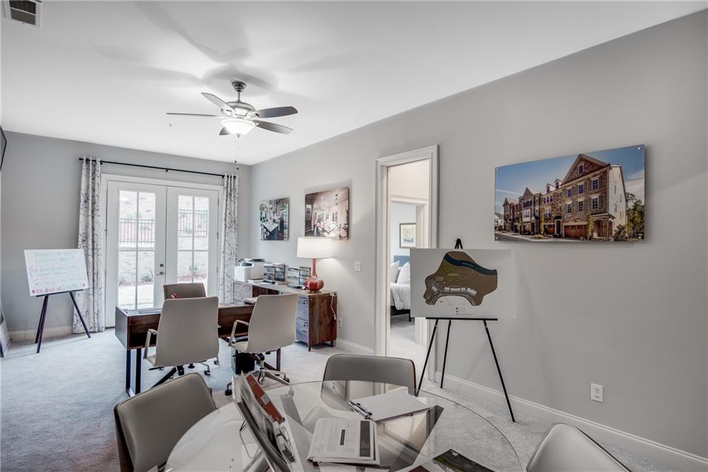 3440 Commander Cove Suwanee, GA 30024 - Photo 47 of 59 a view of a livingroom with furniture and a work space