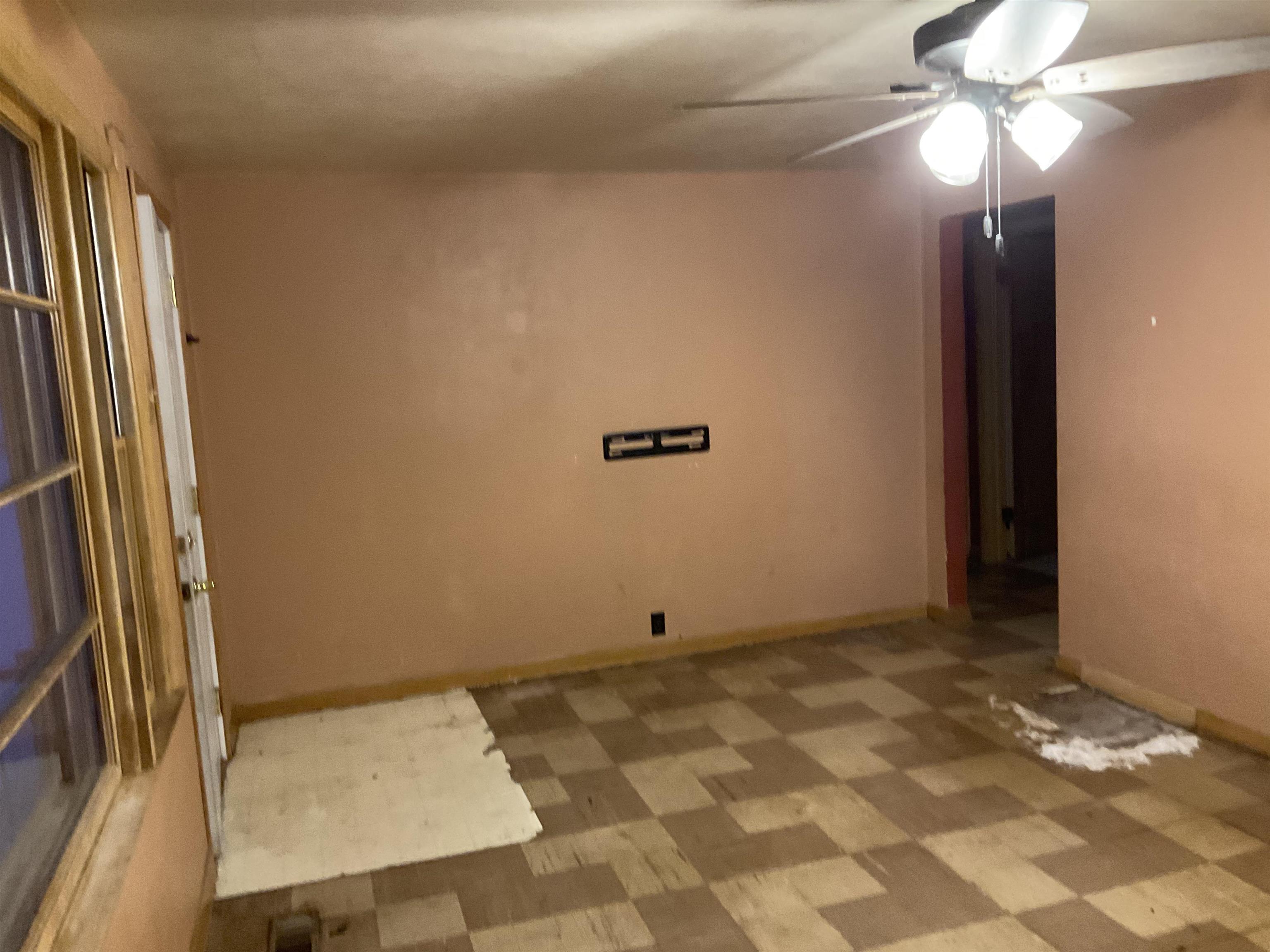 7004 Will James Road Rockford, IL 61109 - Photo 5 of 13 a view of a room with wooden floor and ceiling fan