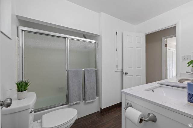2370 Quail Run Circle East Sandy, UT 84093 - Photo 17 of 54 Bathroom featuring a white vanity with an integrated sink, silver-toned faucet, and a quartz-finish countertop