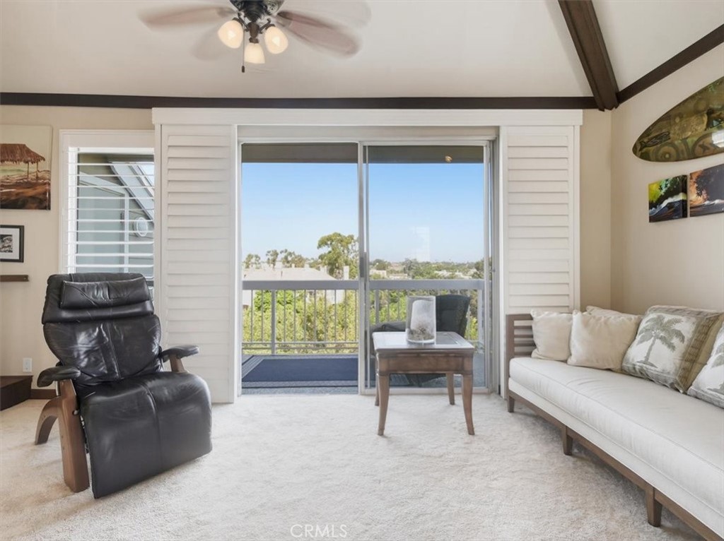 20331 Bluffside Circle, Unit A411 Huntington Beach, CA 92646 - Photo 25 of 44 a living room with furniture and a window